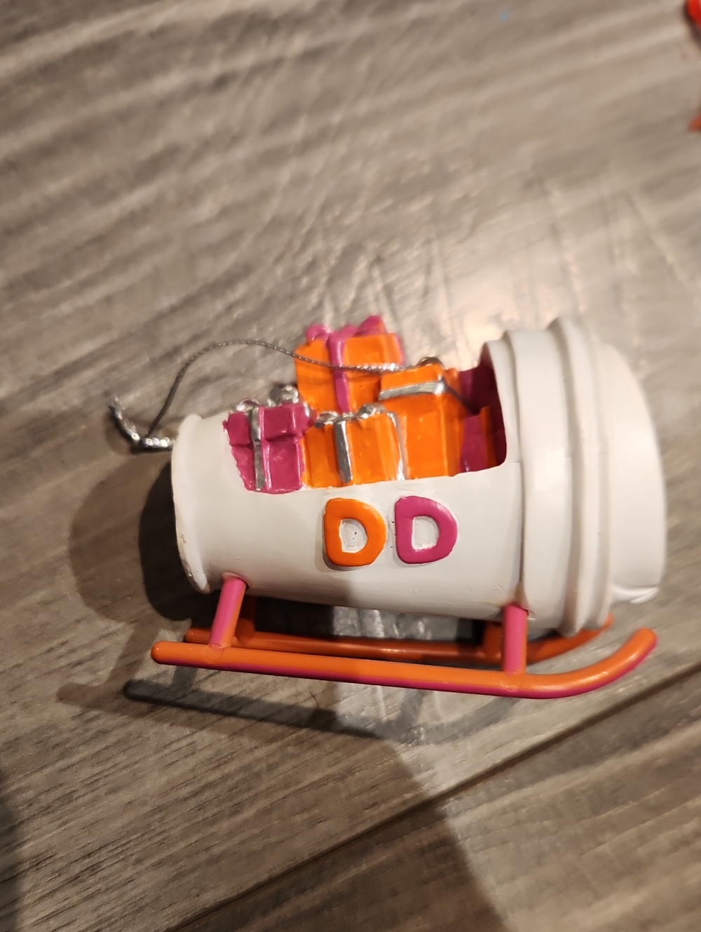 White Kids Sleigh Toy Ornament with Pink and Orange Accents